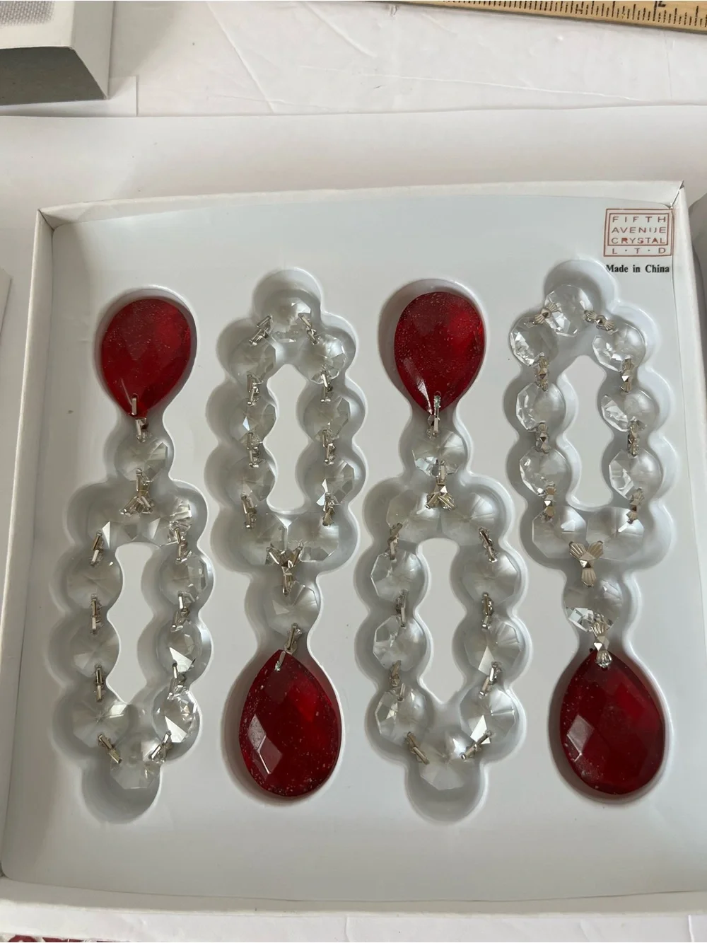 New in Boxes Set of 8 (2 boxes of 4 each) Crystal Faceted Napkin Rings Red Stone